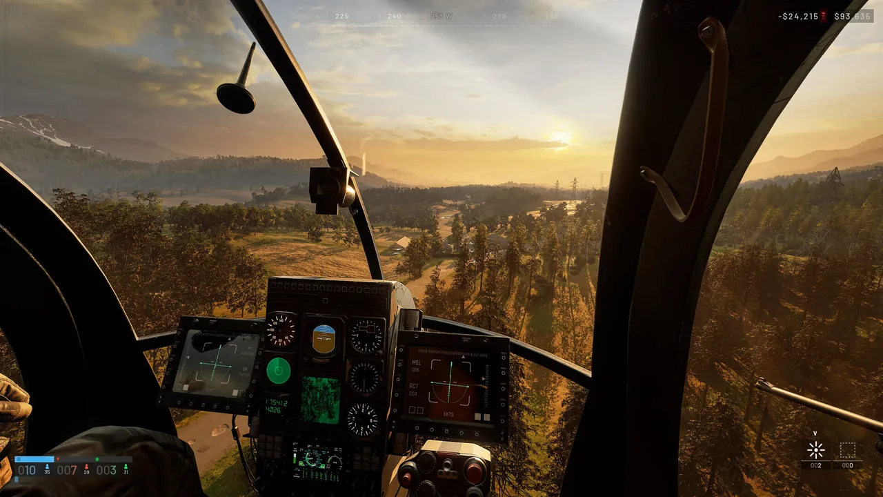 A view from a helicopter cockpit, instruments in the foreground, flying over forested hills in low sunlight.